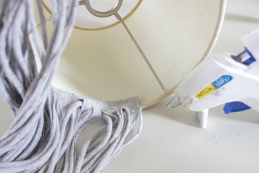 Find a few old t-shirts that have been hanging around your closet and create a whimsical fringe shade.