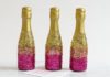 How to Decorate Mini-Champagne Bottles With Glitter