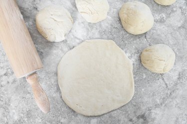 Roll out pizza dough