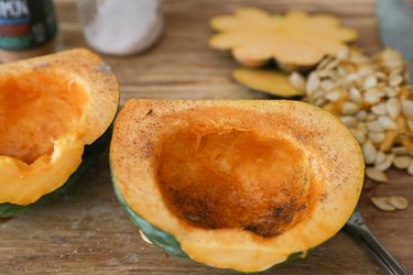 Acorn squash sprinkled with cinnamon and cardamom